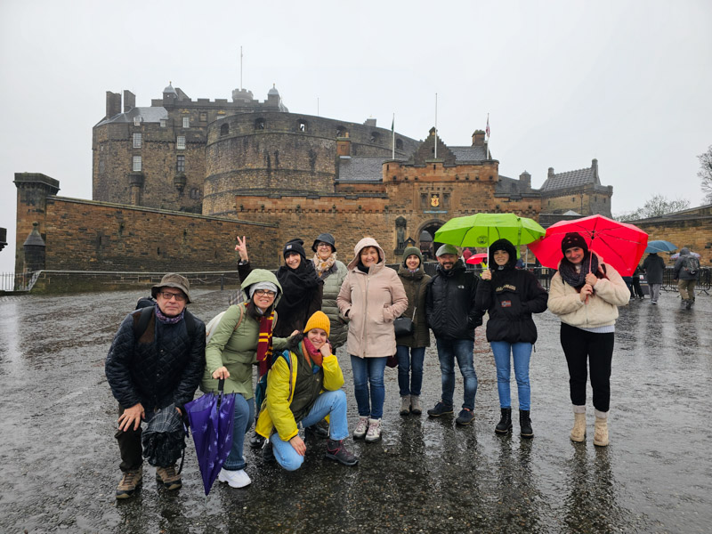 image of a touring group with the castle in background
